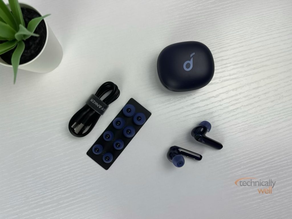 Soundcore Life P3 earbuds and charging case with included accessories: USB-C charging cable and ear tips