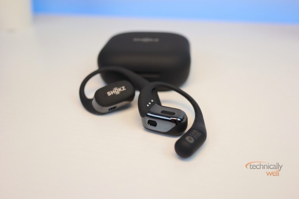 Shokz OpenFit headphones outside of the charging case